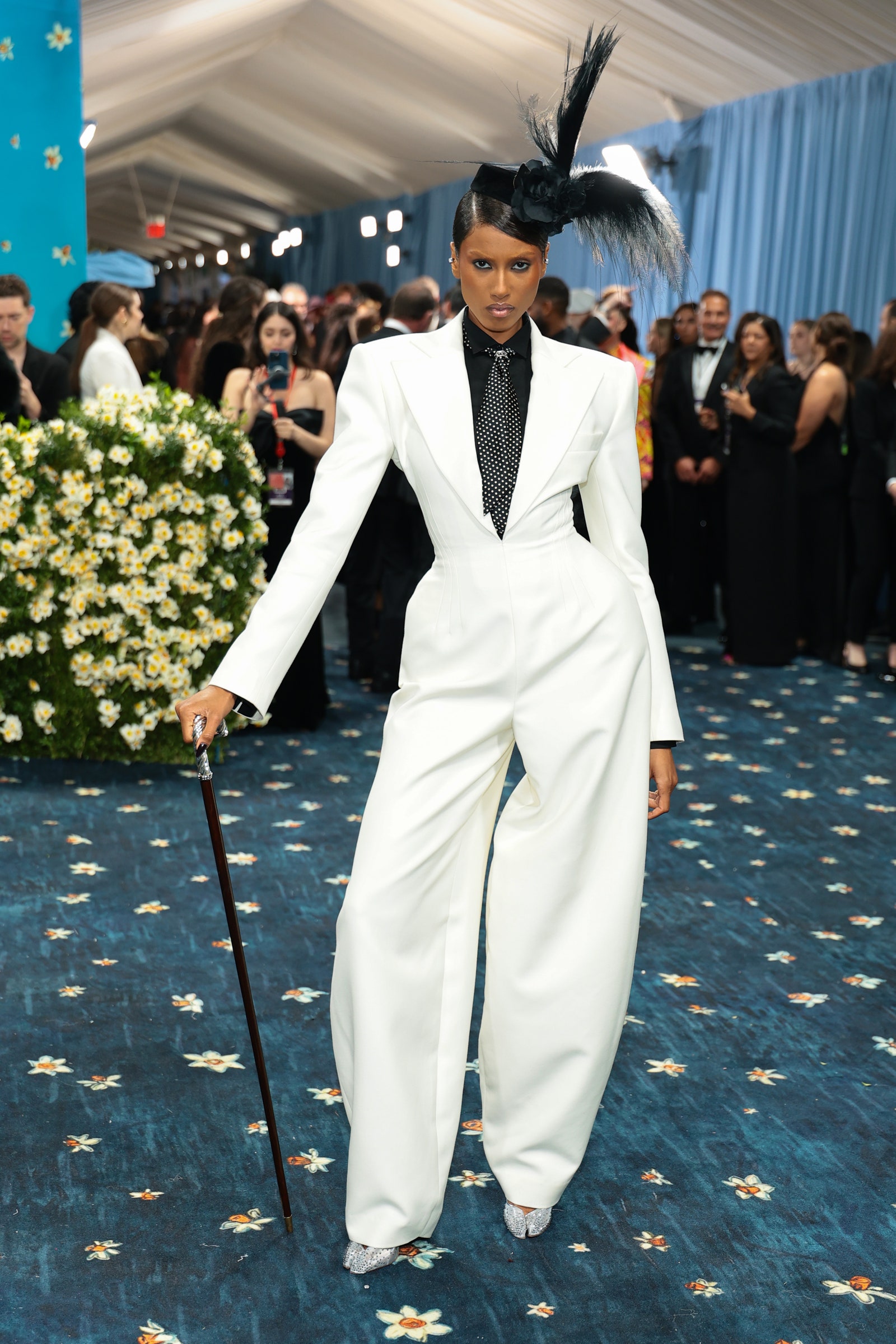 Images may contain Imaan Hammam Barbara Casasola outfit formal suit adult accessories tie and wedding