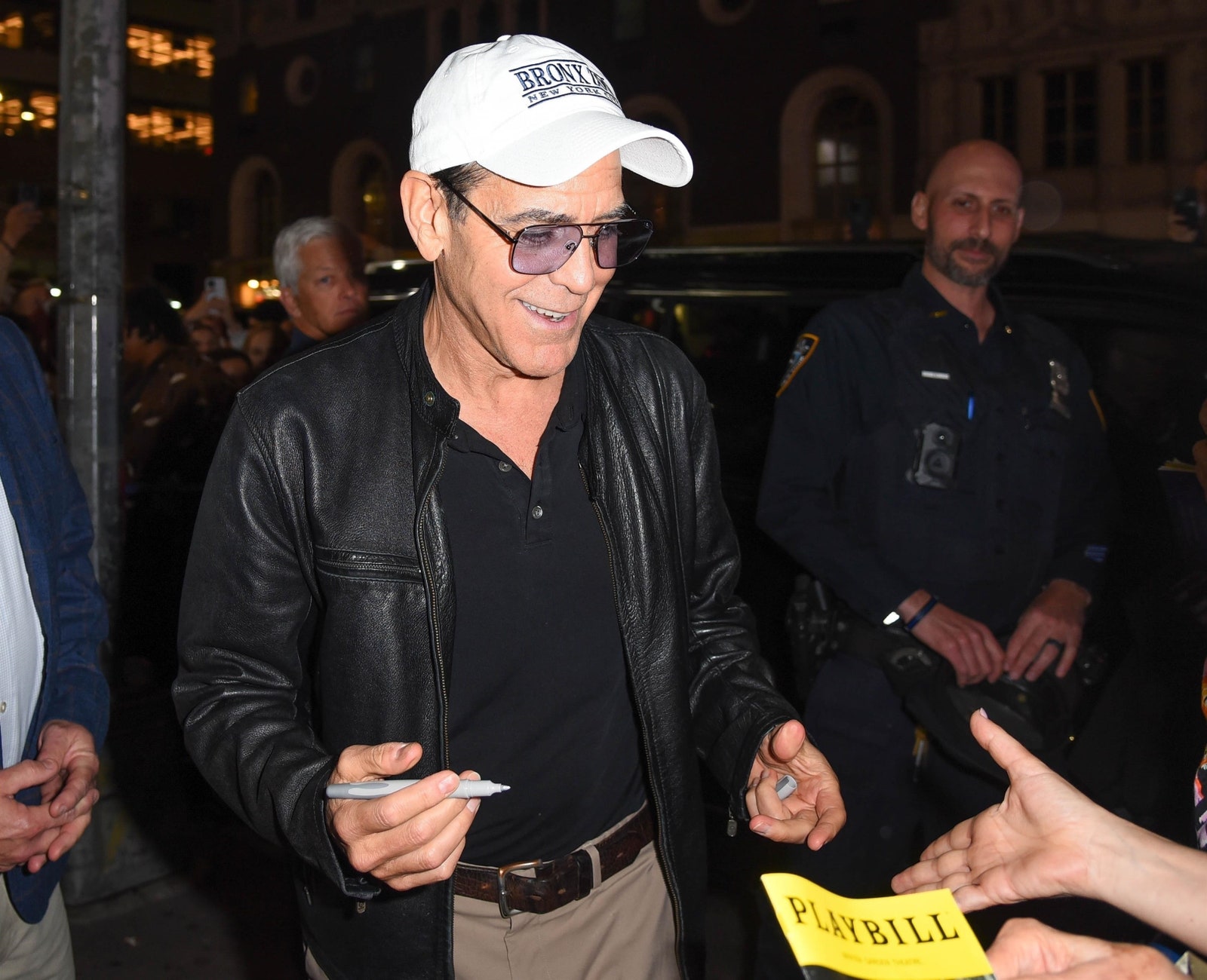 Images may contain George Clooney clothing jacket accessories belt hat glasses baseball cap and adult