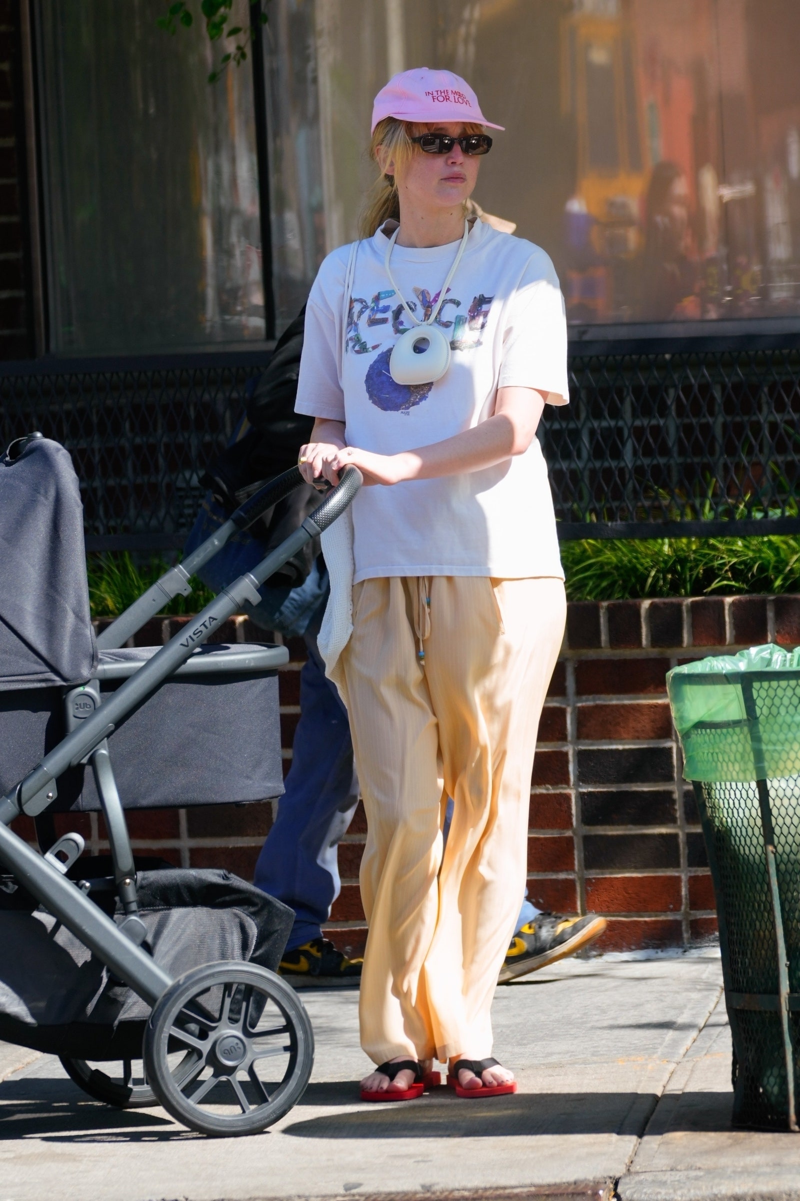 Images may contain Jennifer Lawrence clothing shoes shoes hat adult accessories glasses and jewelry