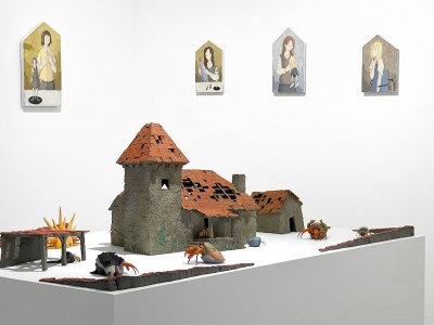 NY Nada New York installation landscape of Nada Pieters booth. Charles Degeyter's sculptures are in the foreground, while Mae Dessauvage's paintings are hung on the wall.