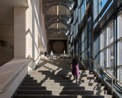 A staircase, people walk up it.