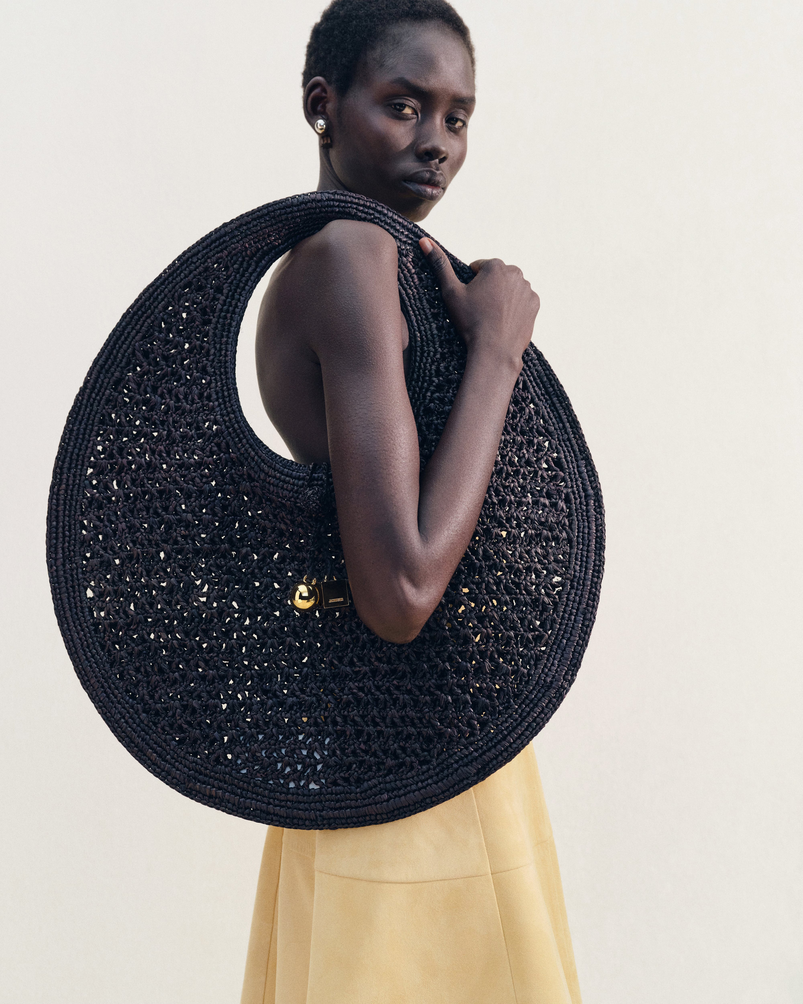 Images may contain accessories bags, handbags, wallets, adult face earrings and jewelry