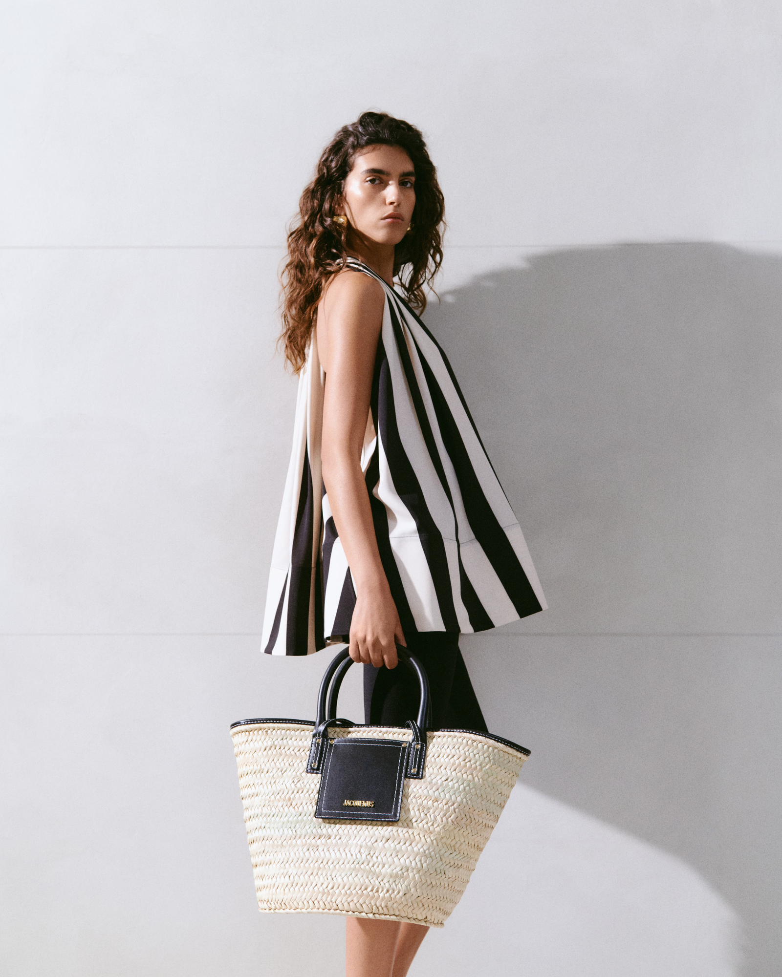 Image may contain accessories bag handbag wallet man teenager handbag clothing jacket face and head