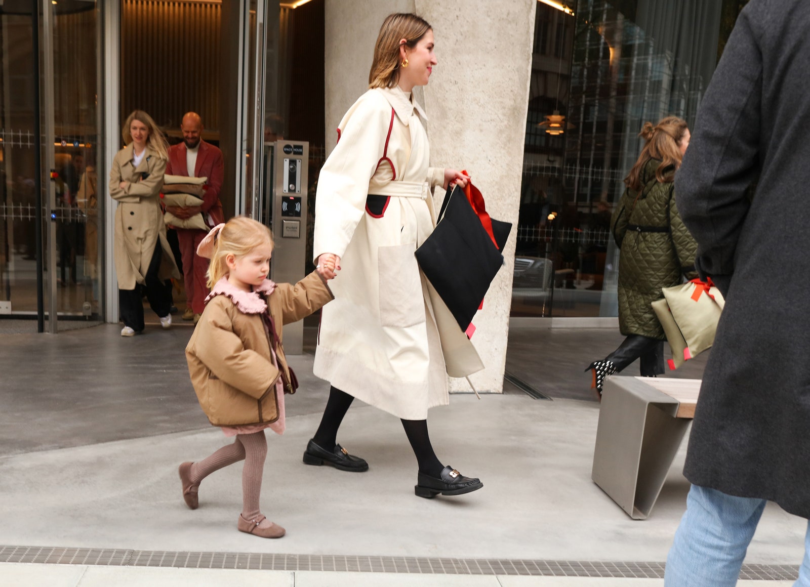 Images may contain clothing coats adult shoes shoes accessories bags tote bags children's heels and sandals