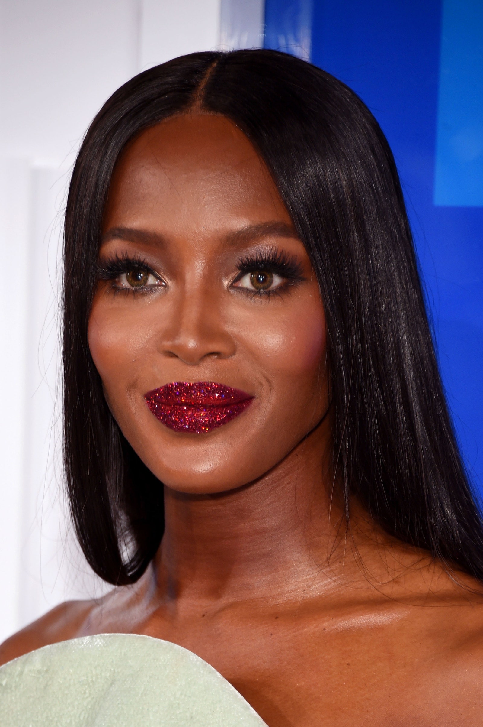 Images may contain Naomi Campbell head face adult body part neck neck black hair and skin