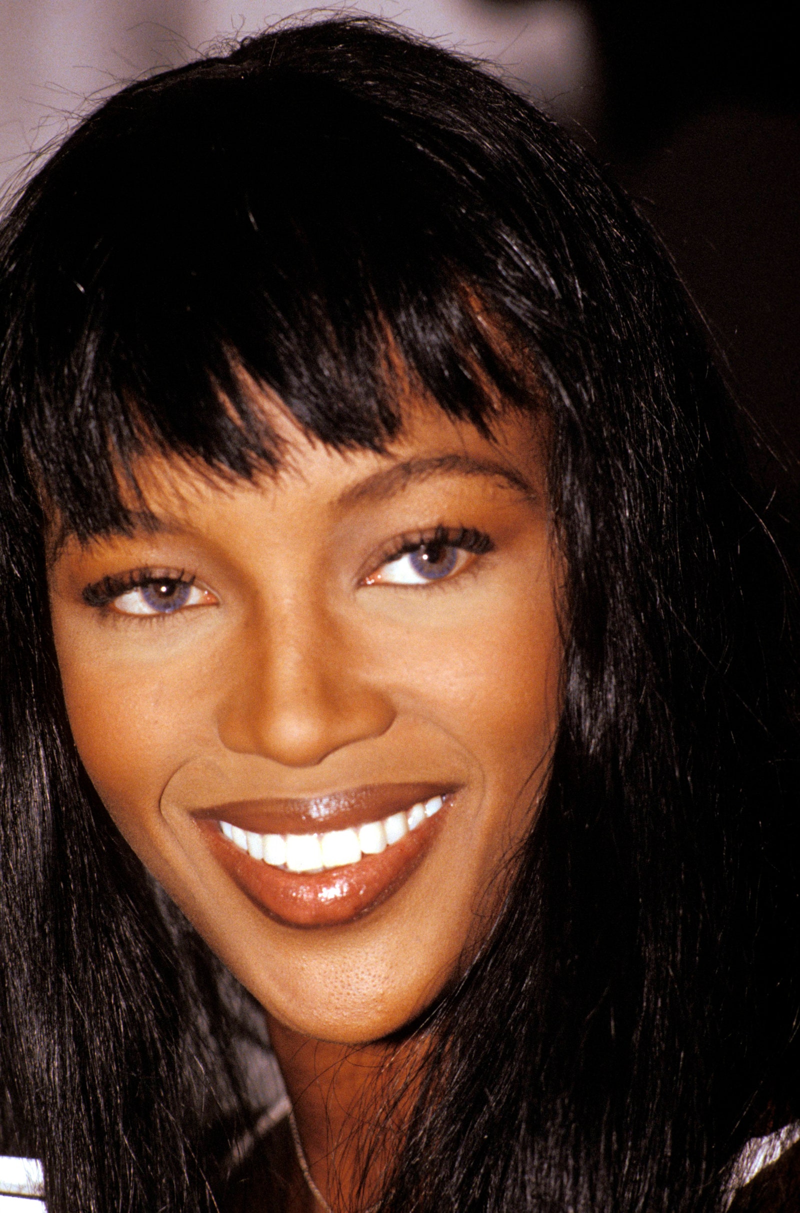 Image may contain Naomi Campbell head man's face, happy adult smile black hair and dimples