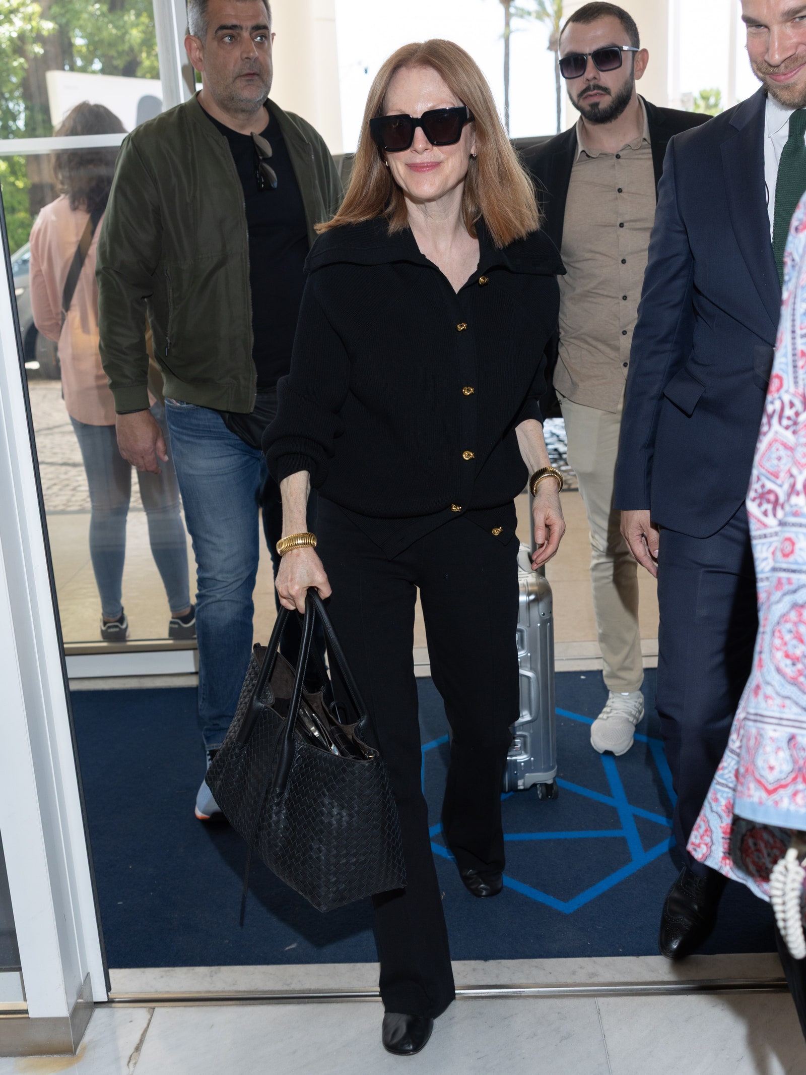 Images may contain Julianne Moore Domiziano Arcangeli General Woo Accessories Tote Bag Clothing Shoes and Shoes