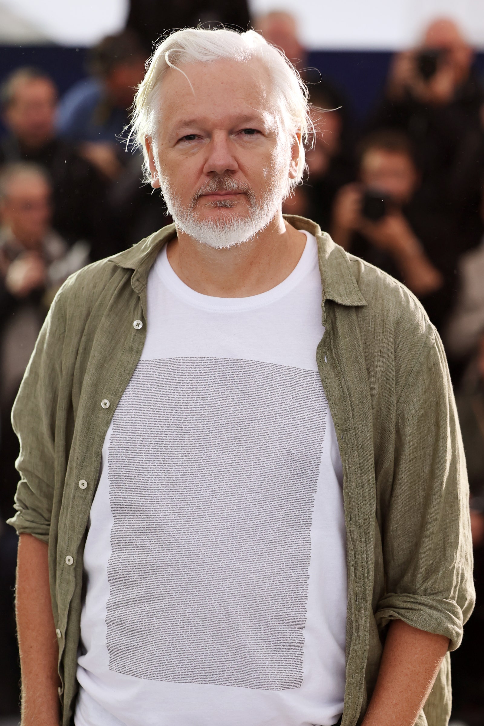 Image may contain Julian Assange blonde adult face happy head smile and elderly