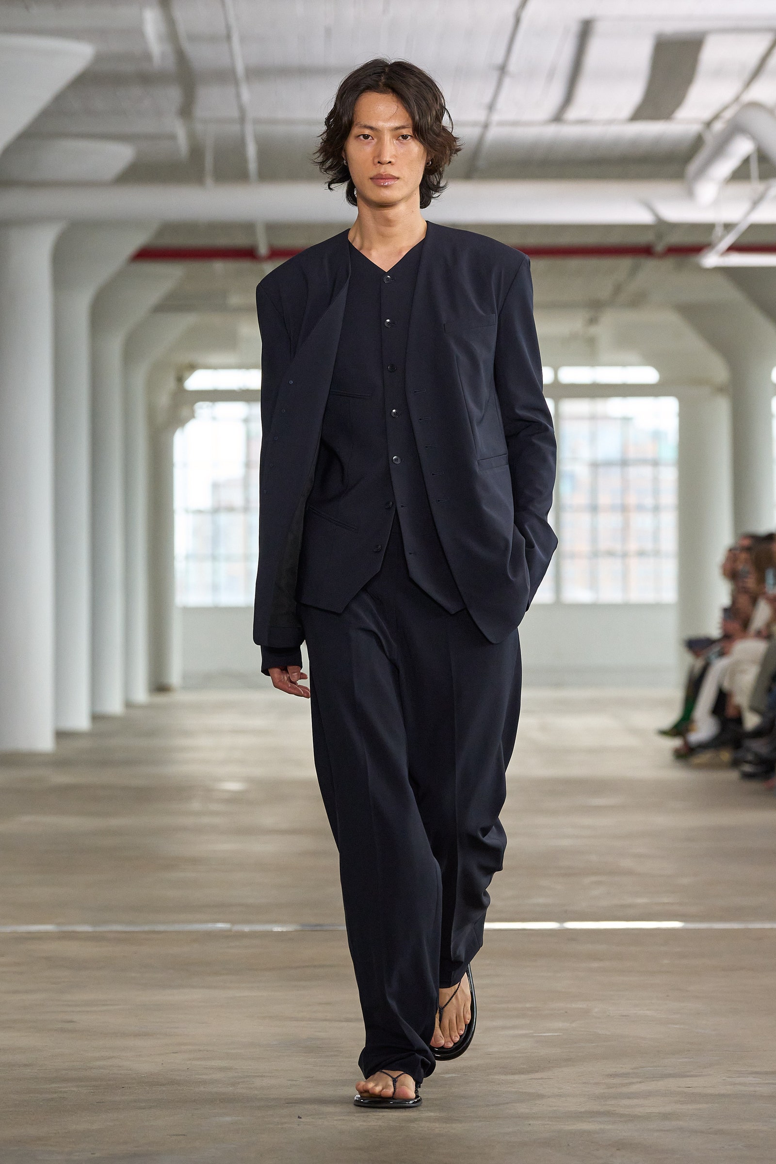 Images may contain clothing formal wear suit jacket jacket adult shoes sandals and stand