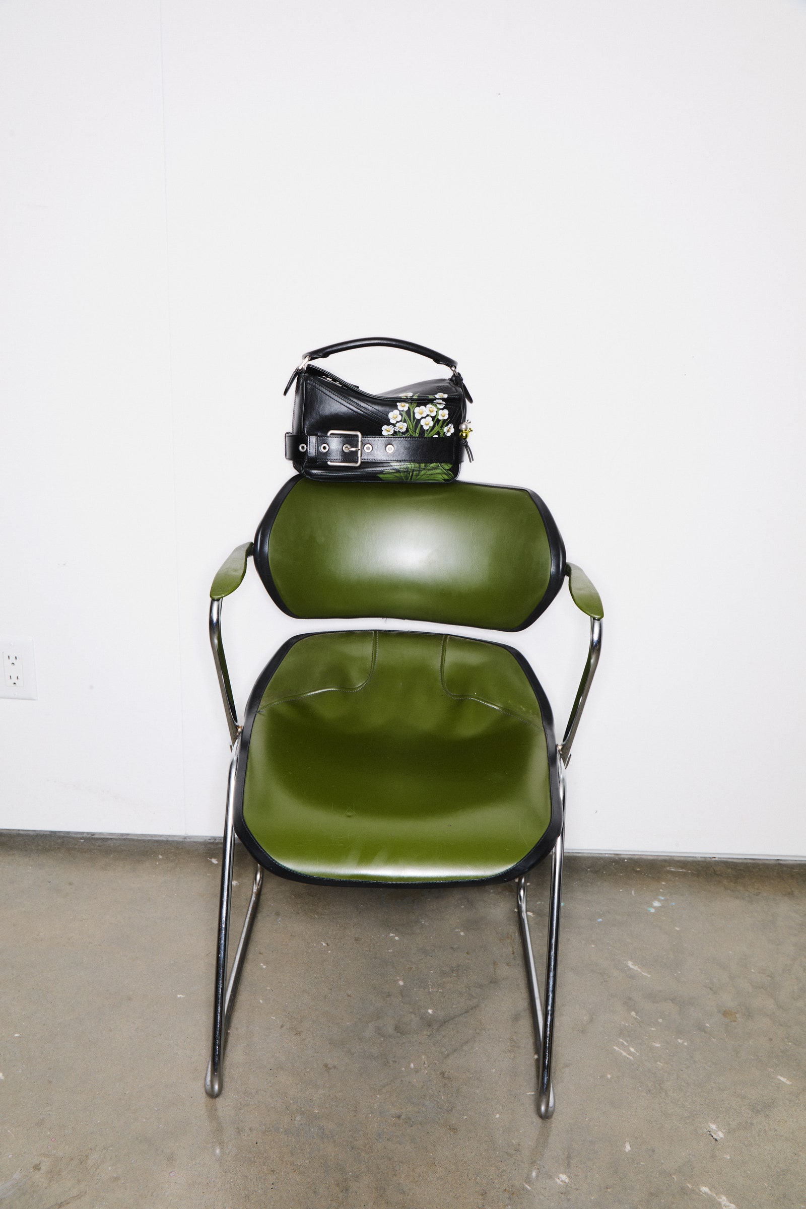 Images may contain furniture chair bag accessories handbags and armchairs
