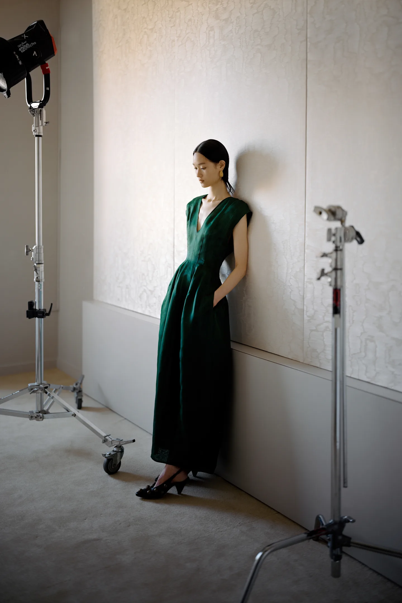 Images may contain Brad Furman adult dress evening dress formal photography and electronics