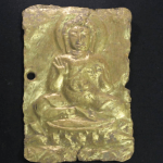 The gold medal depicting the Buddha.