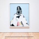 View of Michelle Obama's official portrait of the first lady hanging from the museum wall.