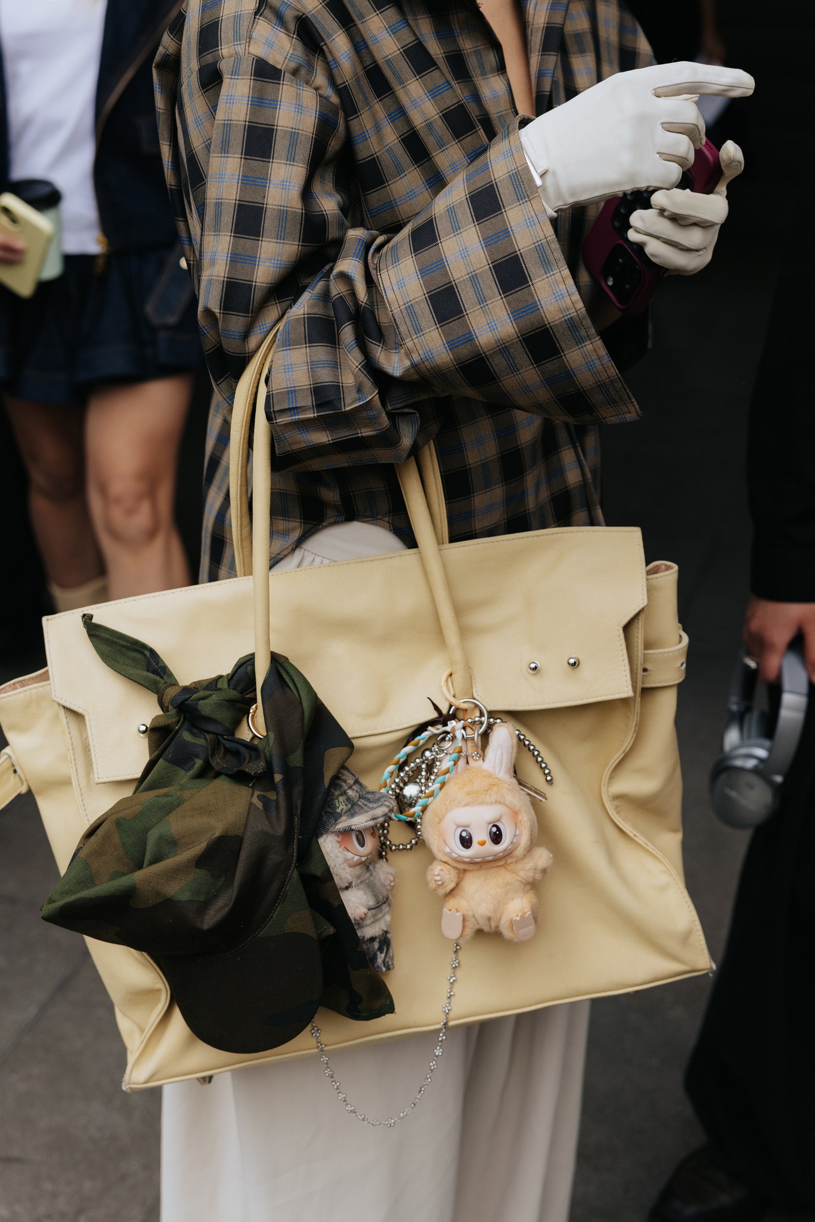 Image may contain accessories bag handbag wallet set electronic headphones people and adults