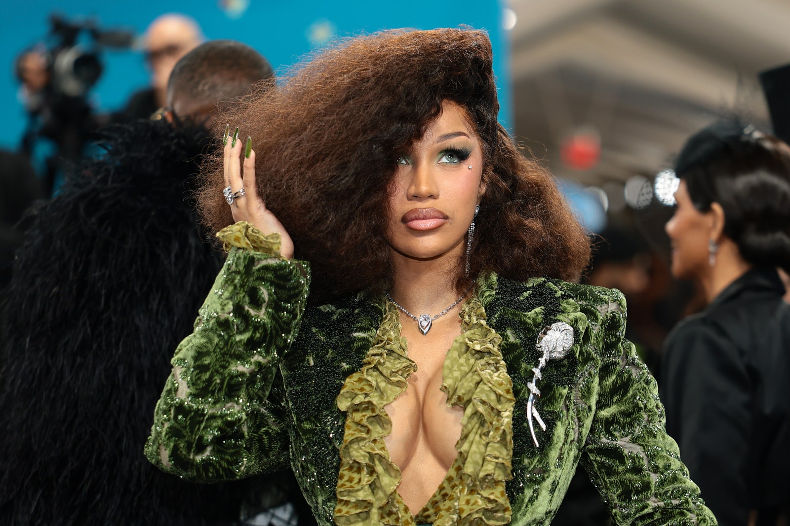 Image may contain nicki minaj adult accessories jewelry necklace ring children face and hair