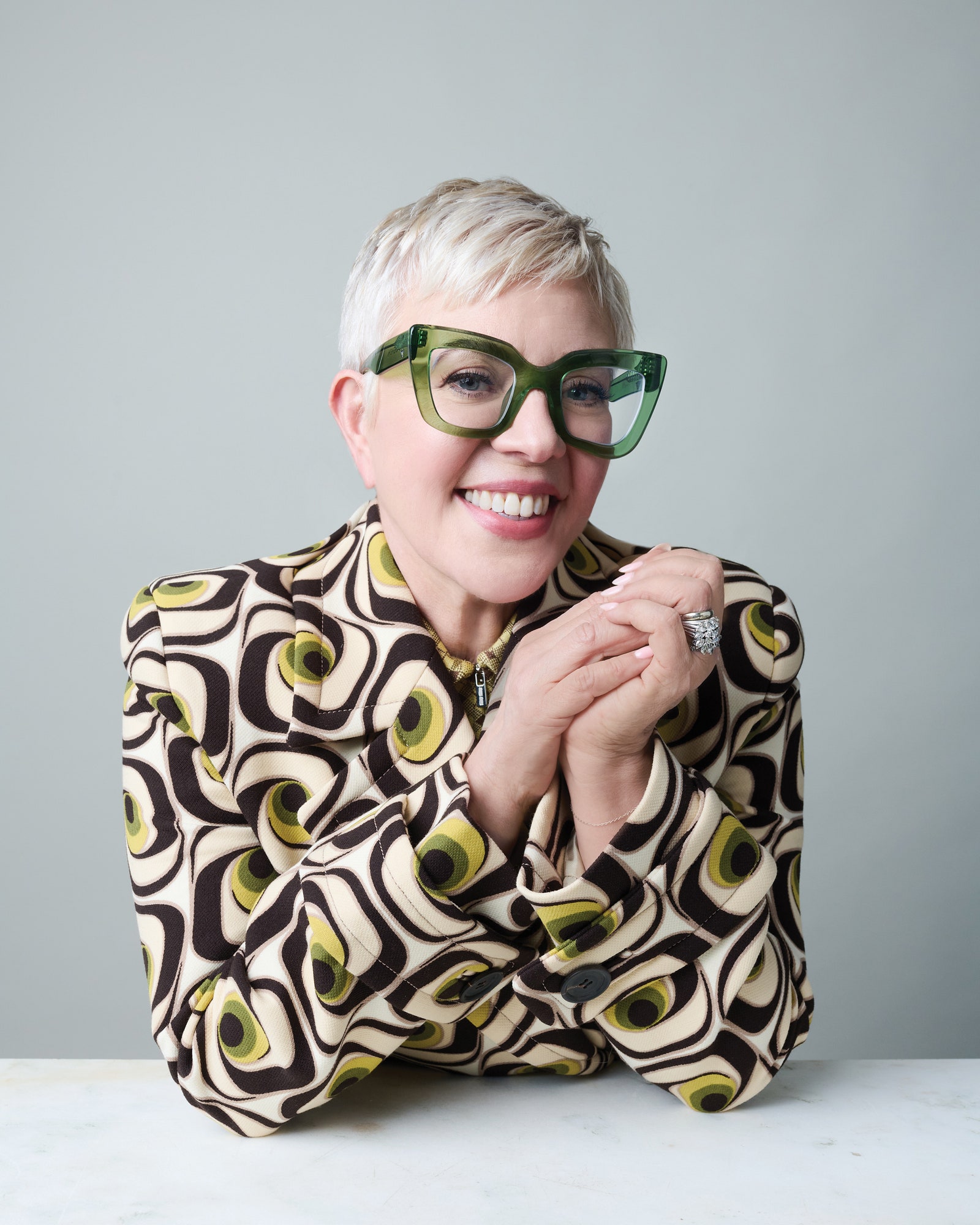 Image may contain Catherine Martin's facial man photography portrait happy smile accessories jewelry and ring