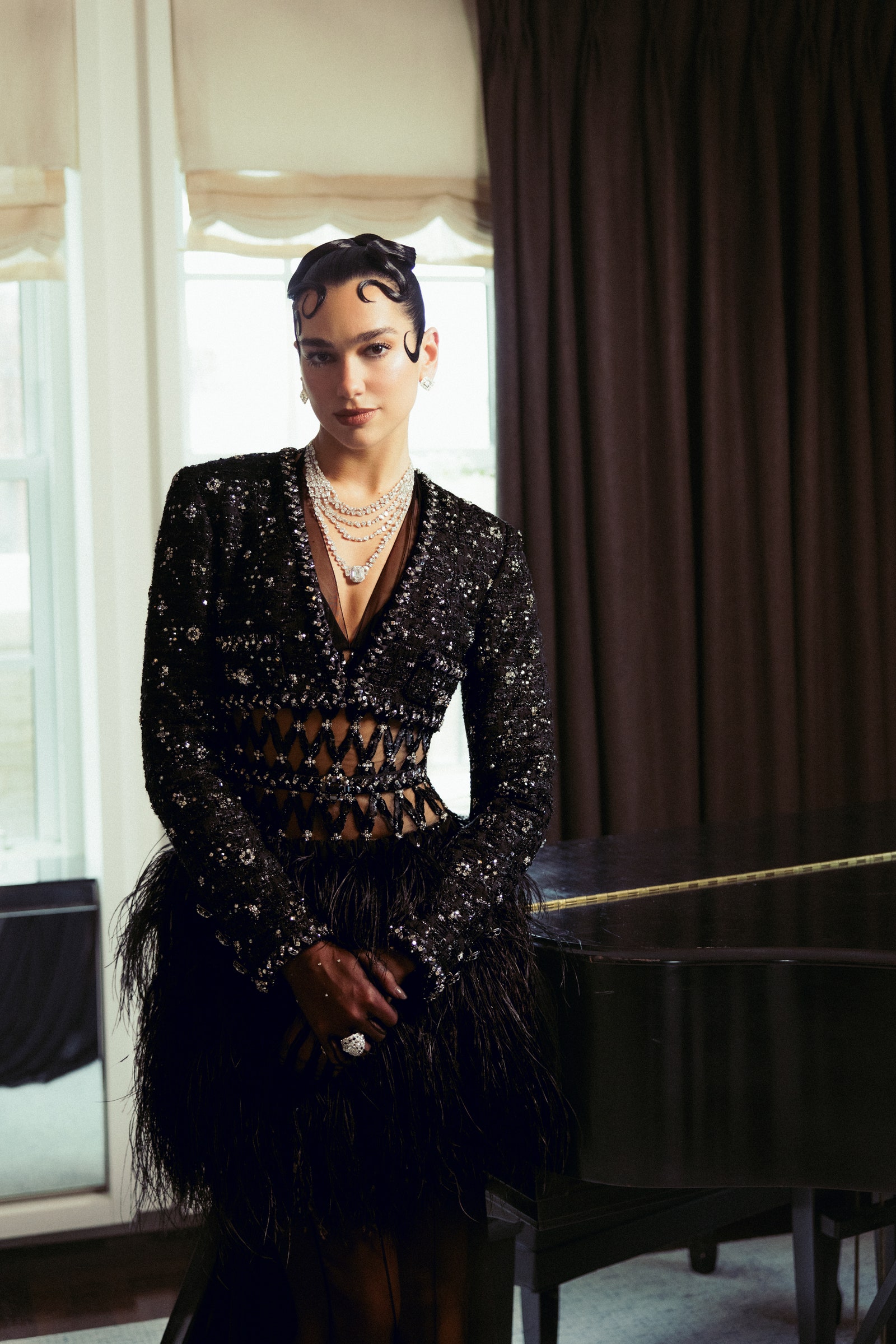Images may contain dua lipa clothing staff formally wearing adult evening dress accessories jewelry and rings
