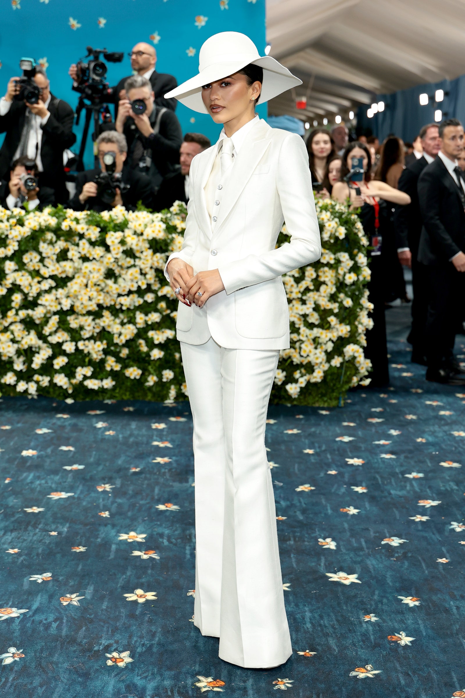 Images may contain Zendaya Bob Harper Andrea Zorzi Tanya Reynolds Man-made Hat Adult Formal Wear and Suit