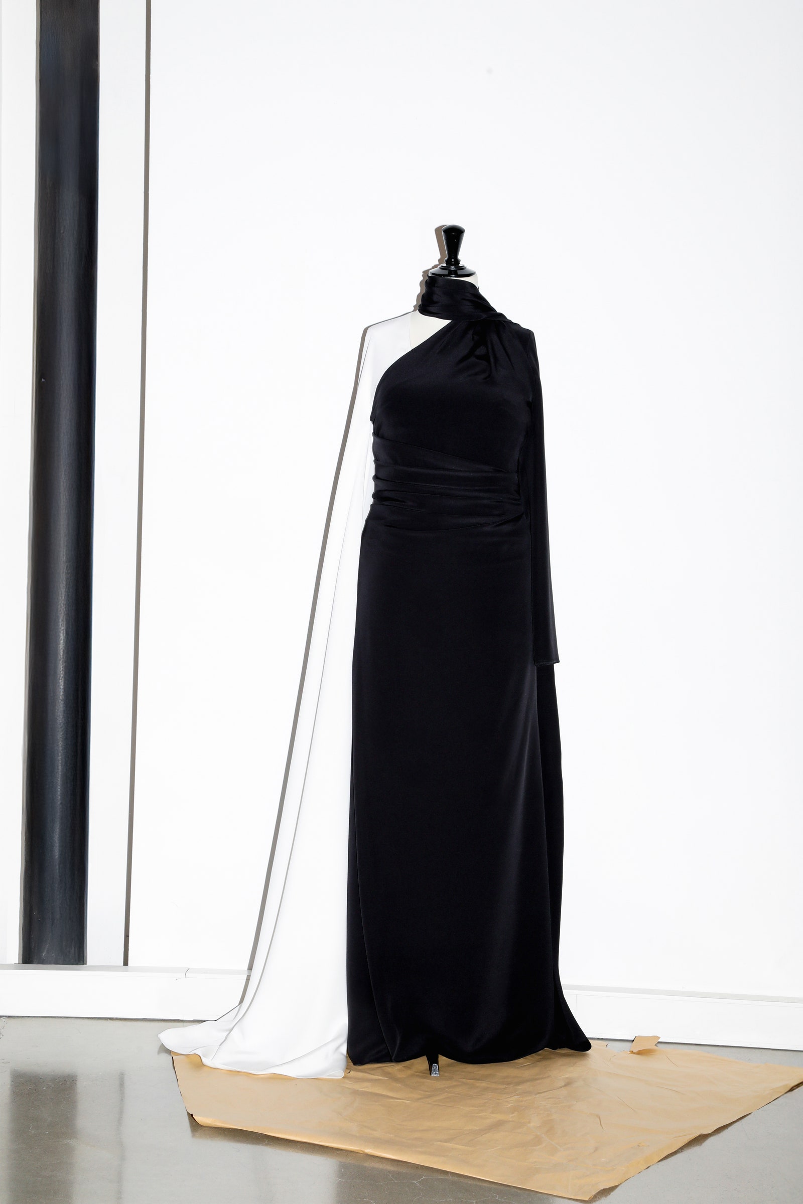 Images may contain fashionable adult clothing gown formally wearing robe and robe