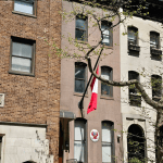Flags outside the building.