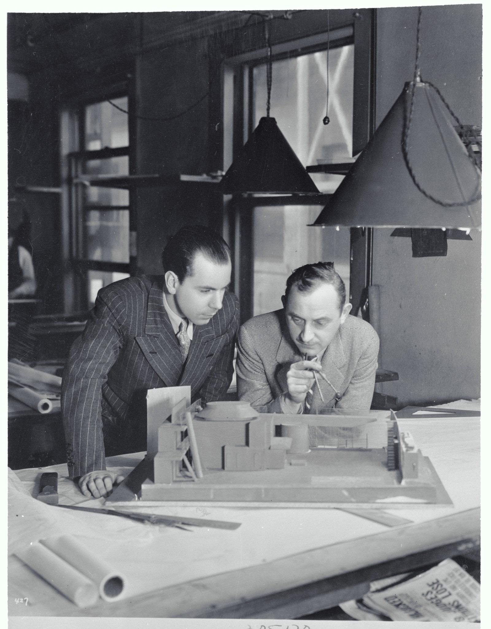 Images may contain Basil Radford George Finman lamp table adult face and photography