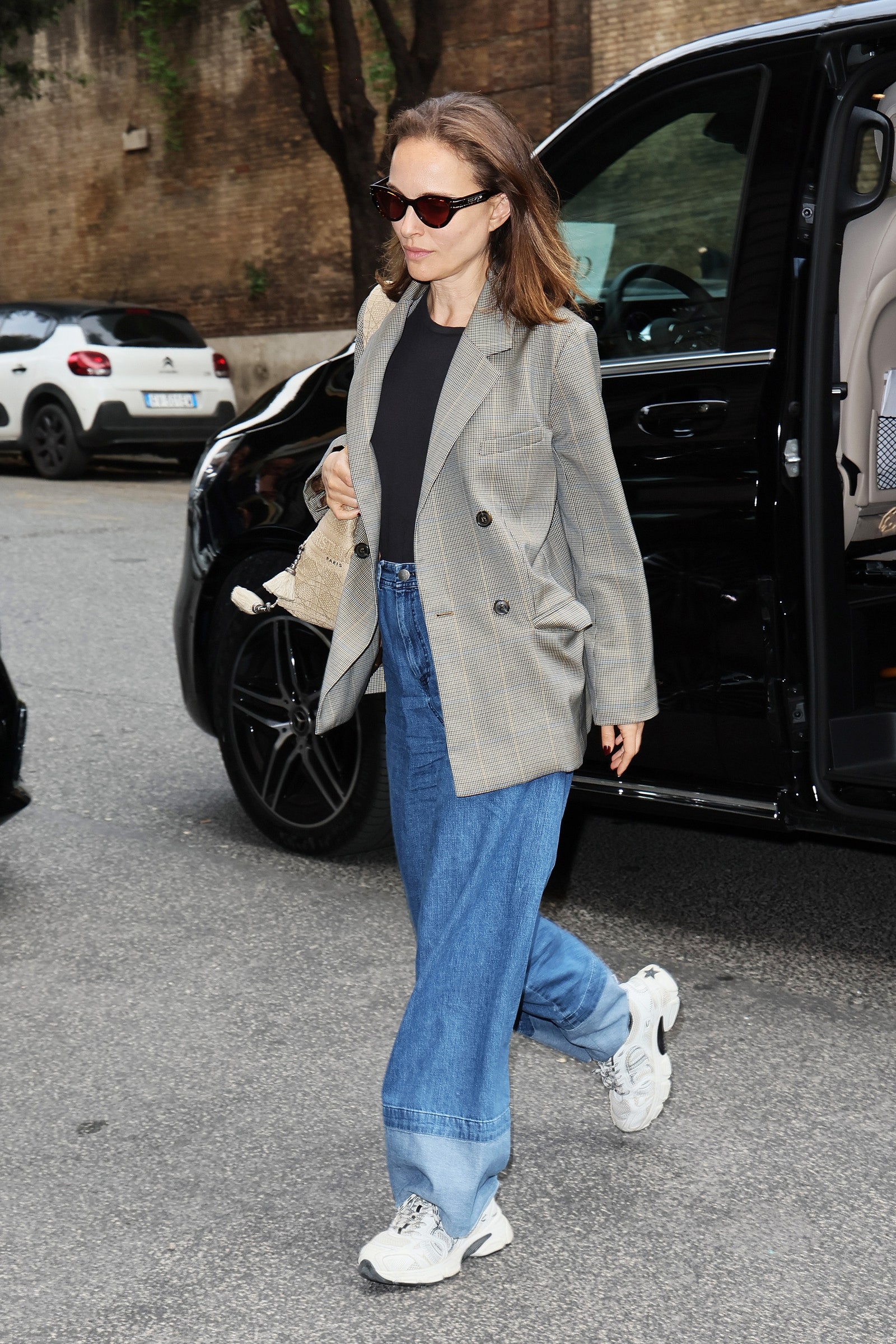 Images may contain Natalie Portman Clothing Pants Jeans Men Teen Shoes Shoes Accessories Glasses Jackets and Cars