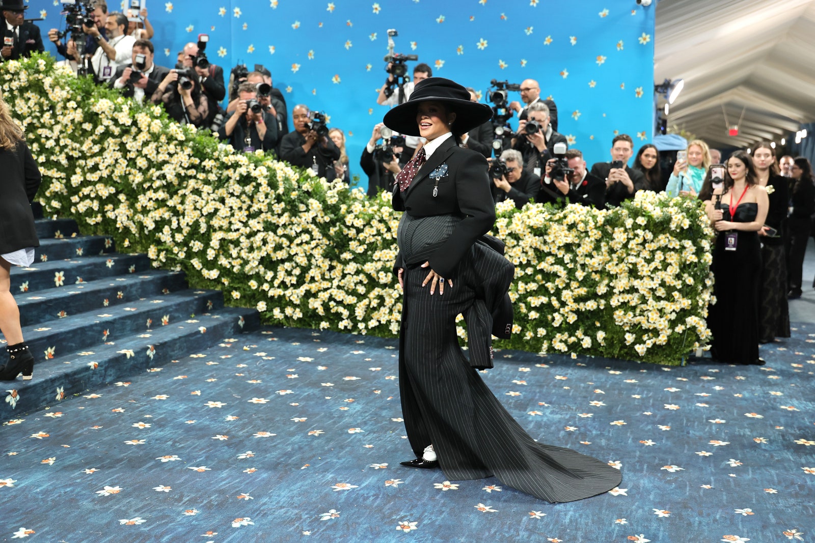 Images may contain Rihanna Sergio Verdú people costume hat photography adult accessories formal wear and tie