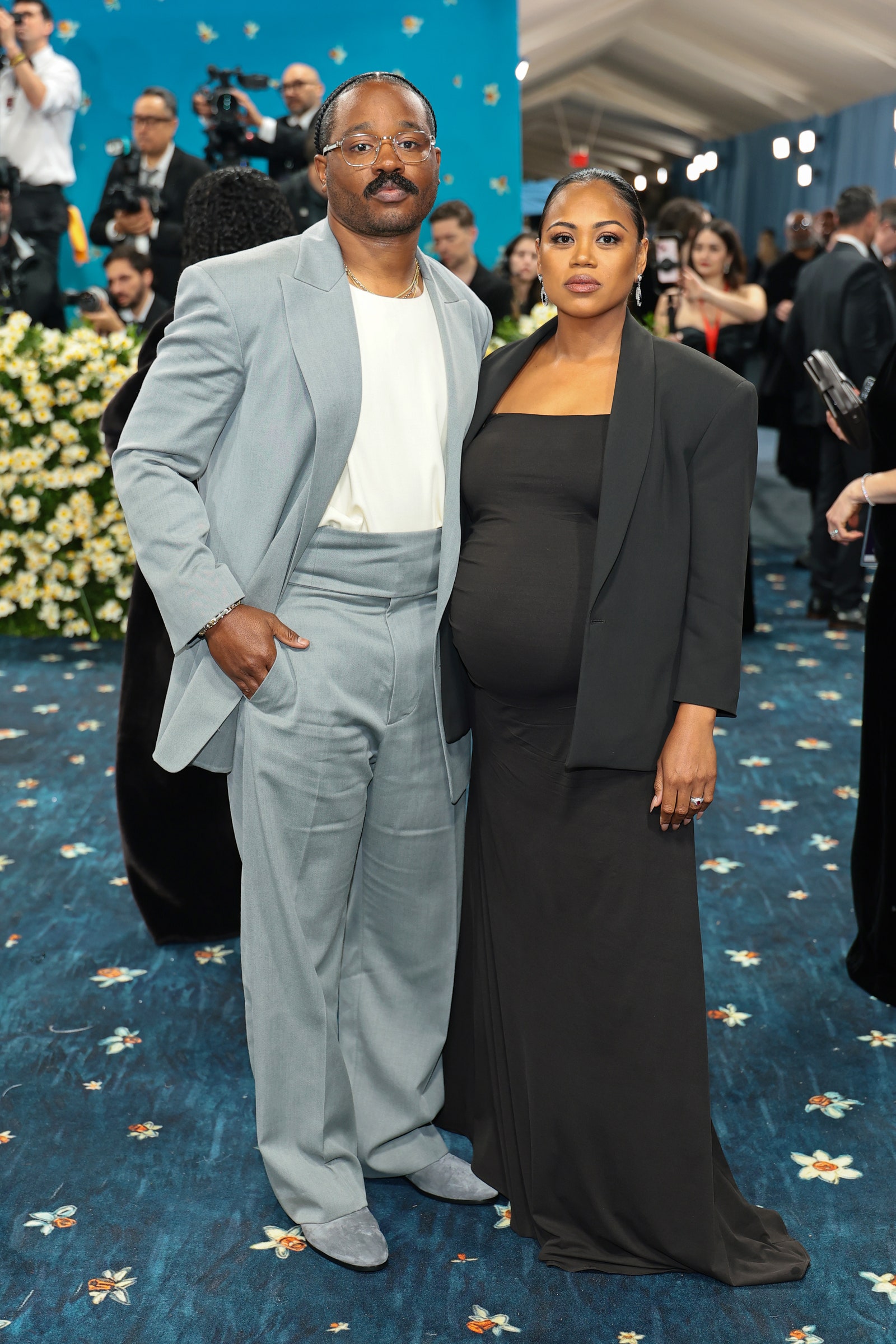 Images may contain Ryan Coogler adult accessories glasses jewelry necklace blazer and jacket