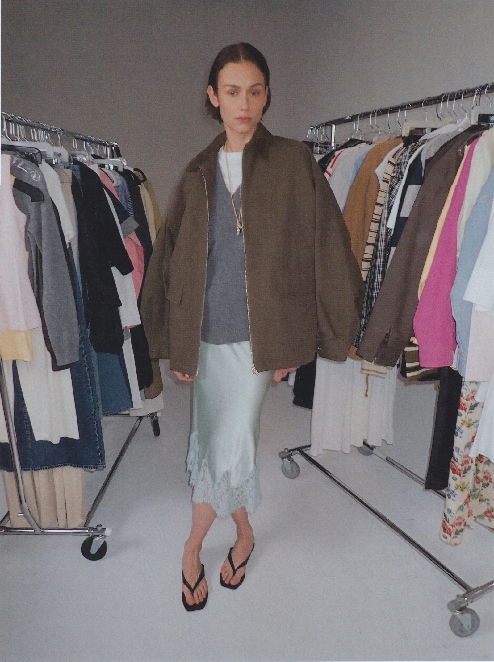 Images may contain clothing shoes shoes accessories jewelry necklace sandals interior jacket and furniture