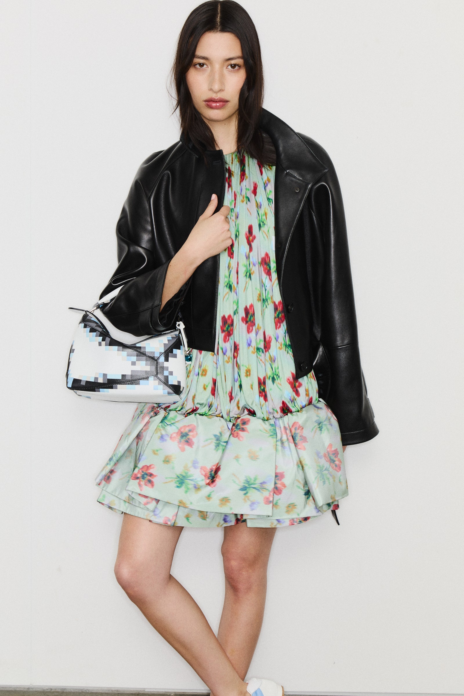 Images may contain clothing jacket adult accessories bags and handbags