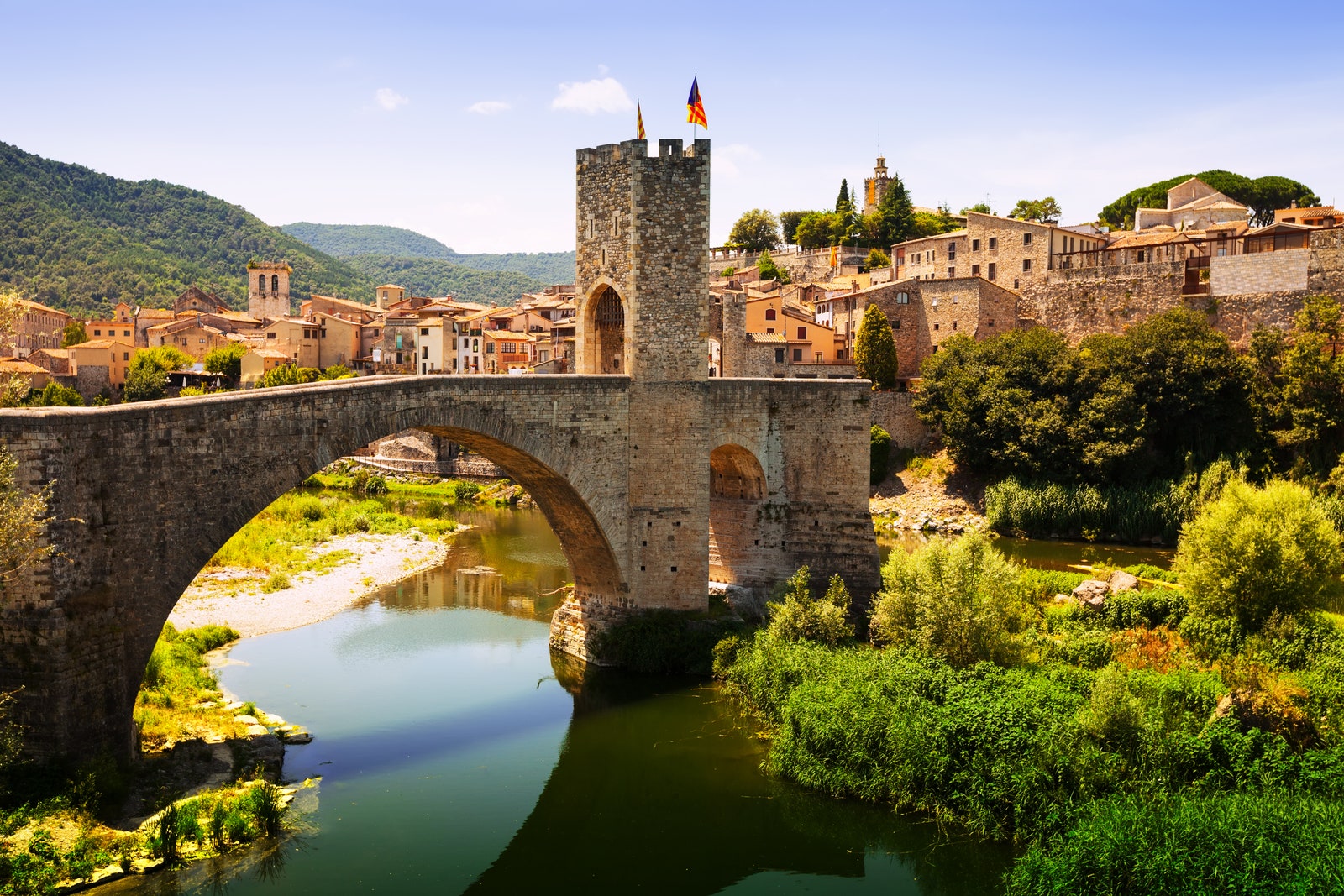 Images may contain architecture, castle fortress nature outdoor landscape arch flag cityscape and city