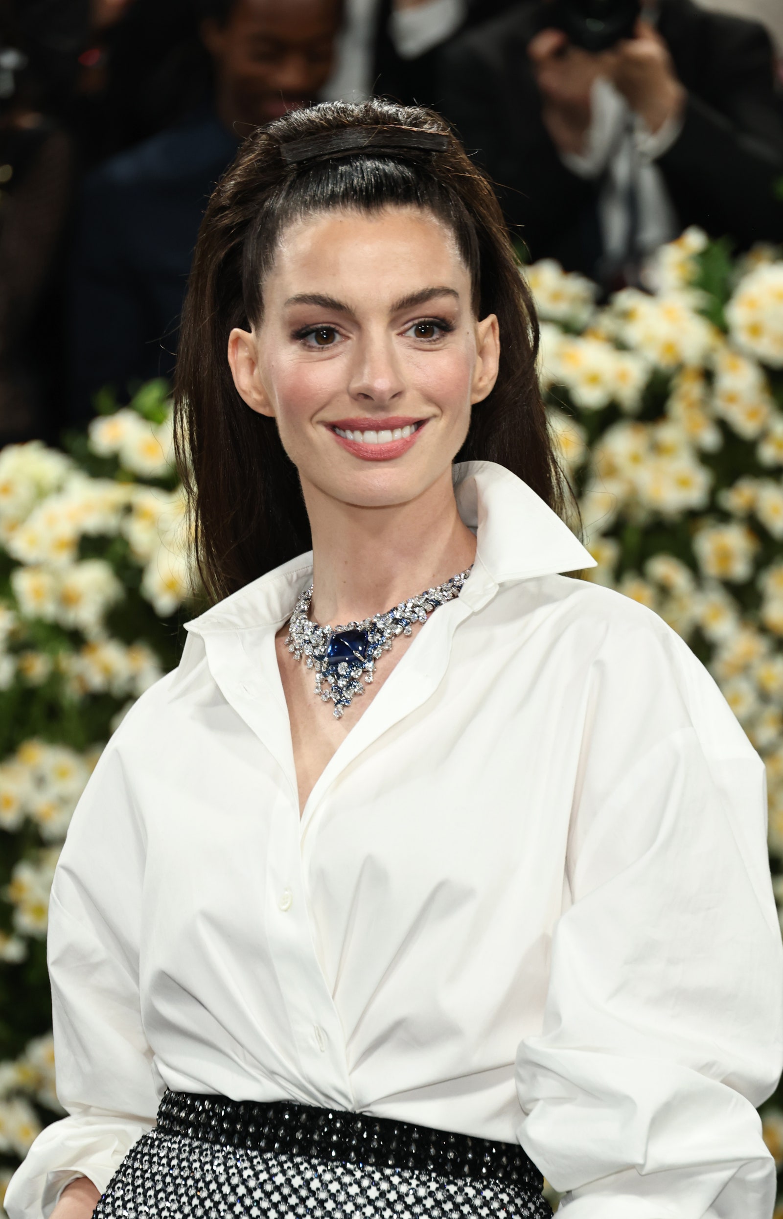 Image may contain Anne Hathaway top dress face happy head man smiling adult accessories and jewelry