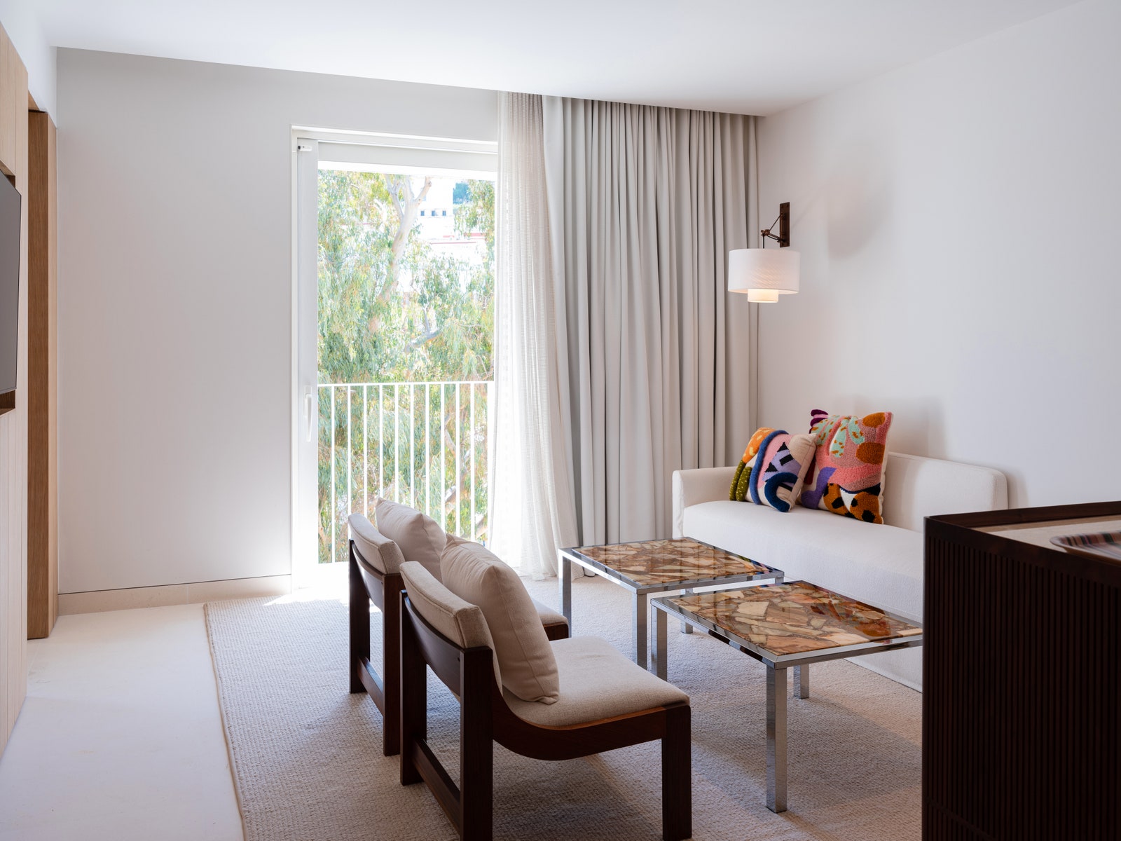Images may contain home decoration building architectural furniture in indoor living room coffee table and chairs