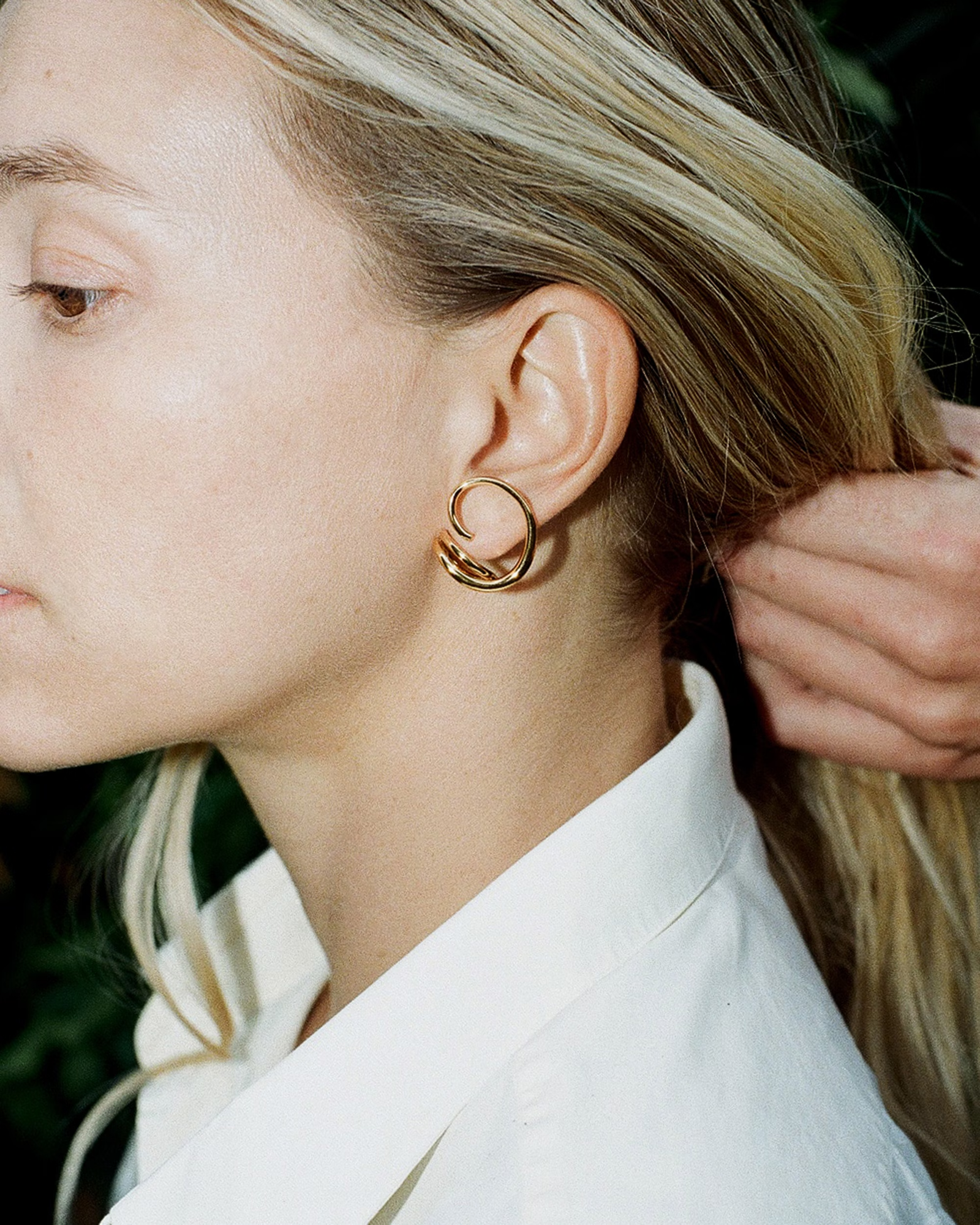 Images may contain accessories earrings jewelry adult face and head