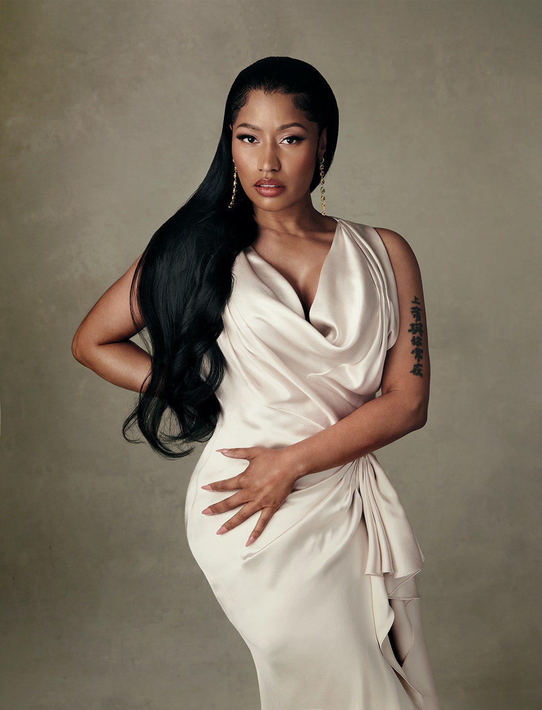 Images may contain nicki minaj black hair adult clothing dress formally worn face and photography