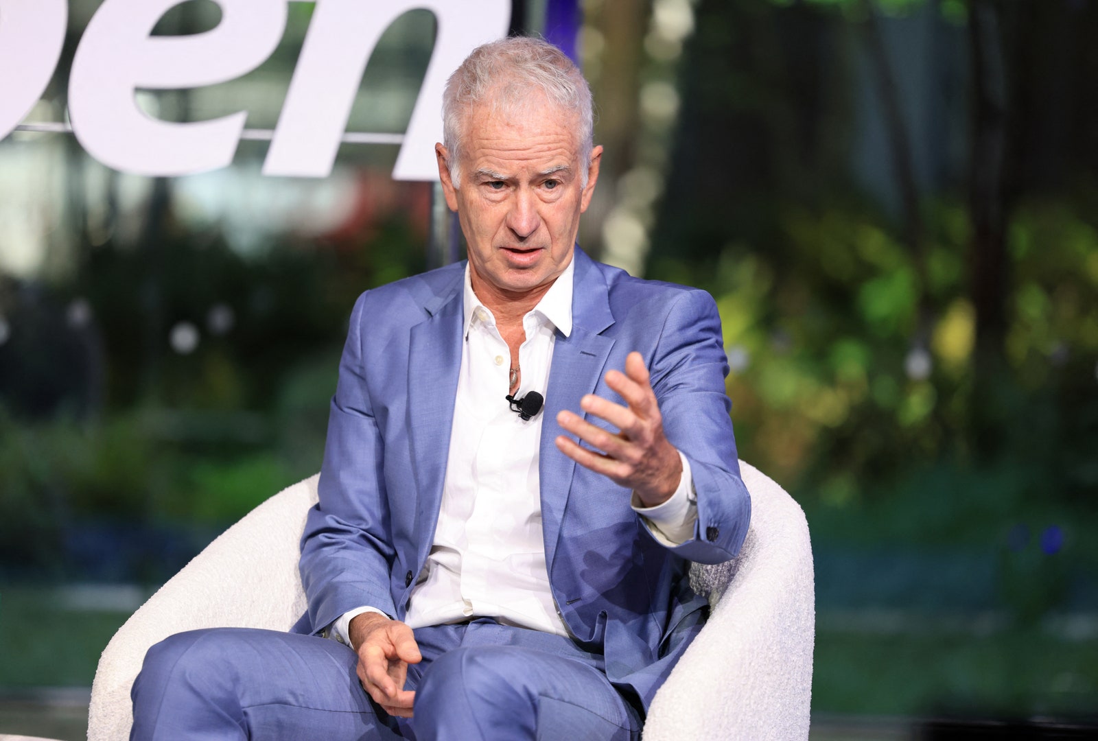 Images may contain John McEnroe adult electrical equipment and microphone
