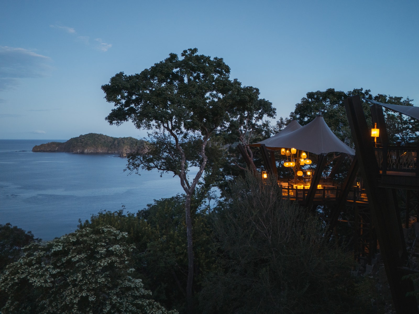 Image may contain buildings in outdoor shelter land natural landscape plants rainforest trees and vegetation