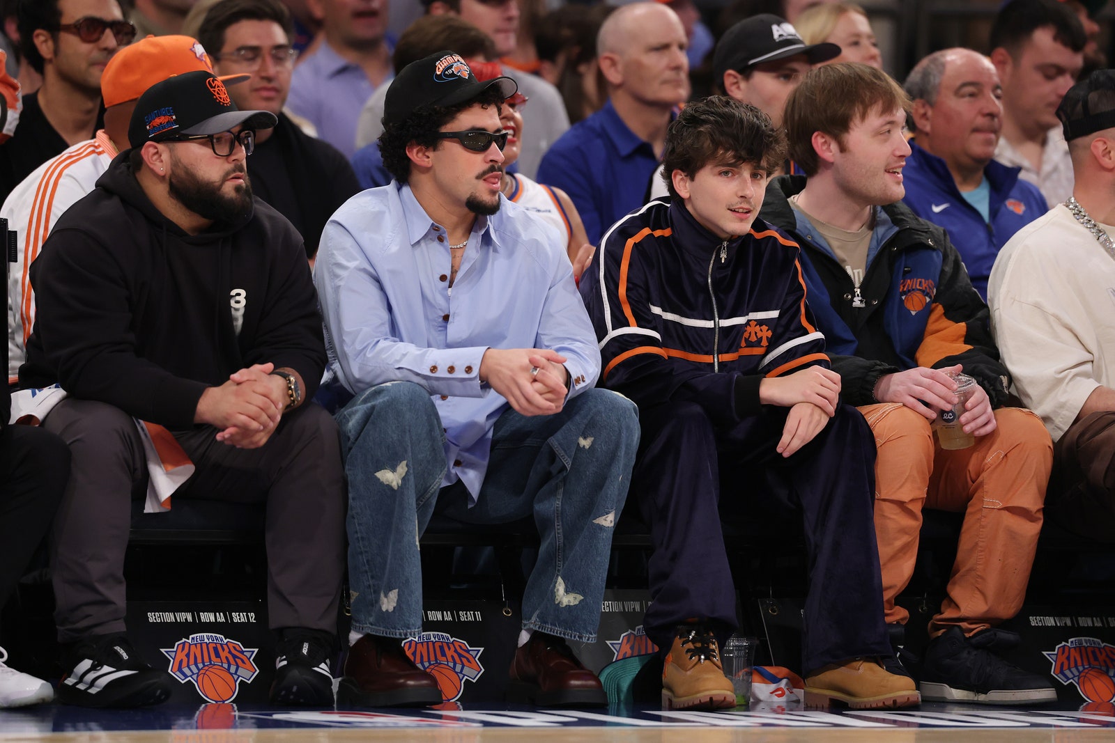 Images may contain Antonio Garay Bad Bunny Timothe Chalamet Bad Bunny Clothing Hat and Shoes