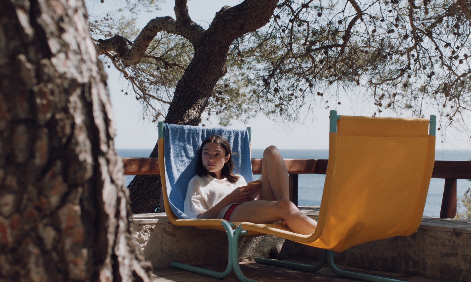 Image may contain Natasha negovanlis chair furniture adult sitting and sunbathing