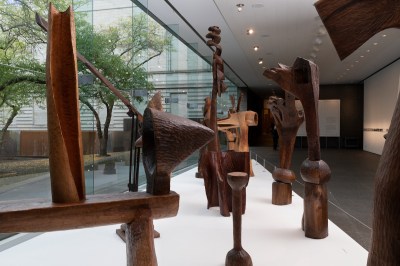 A group of wood sculptures in the museum.