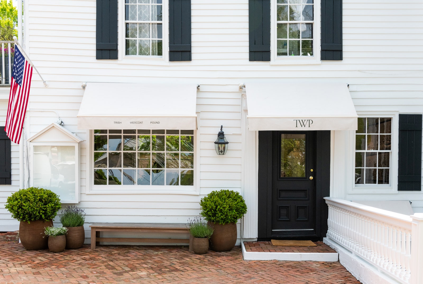 Images may contain flags, plant lights, benches, furniture, architecture, houses and porches