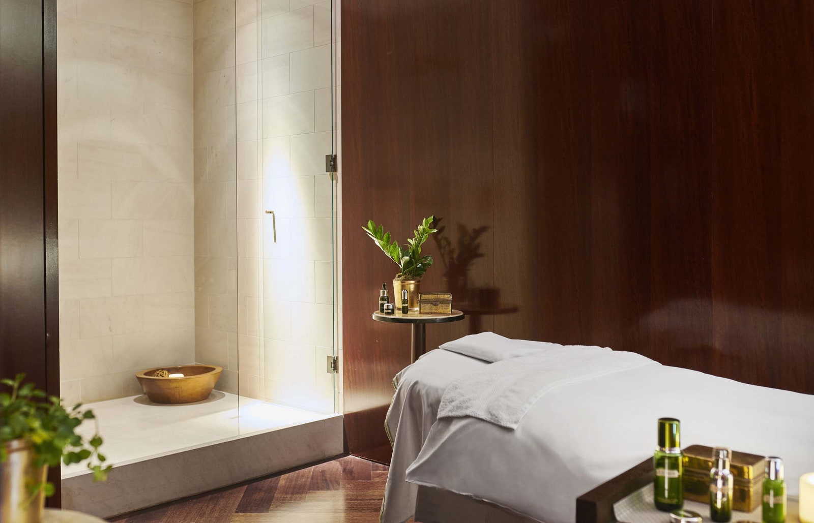 Images may contain interior design plant spa bottle cosmetic perfume bed furniture and wooden boards
