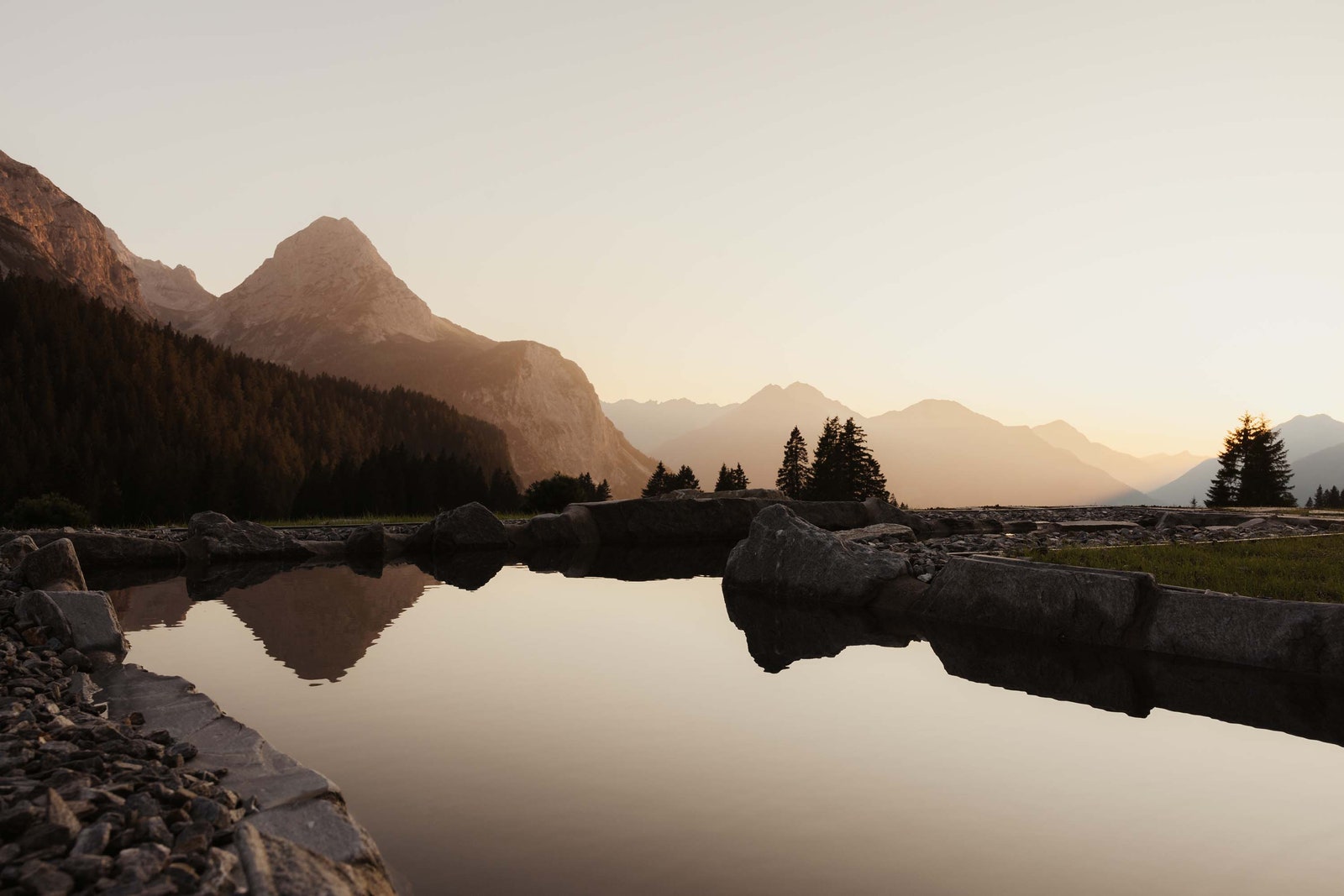 Images may contain landscape nature outdoor scenery mountains mountain peaks wilderness plants trees and lakes
