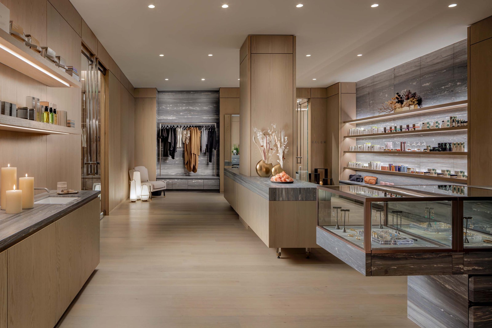 Images may contain shop interior candle chair furniture sink interior design faucet room and Walkin closet