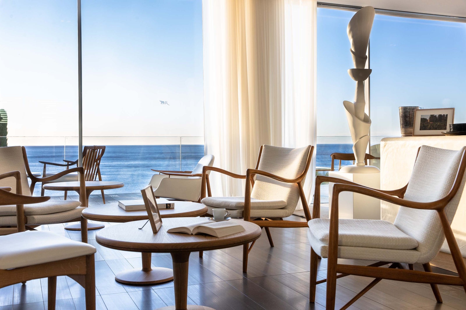 Images may contain books, publications, chairs, cups, art paintings, architecture, interior and lounge