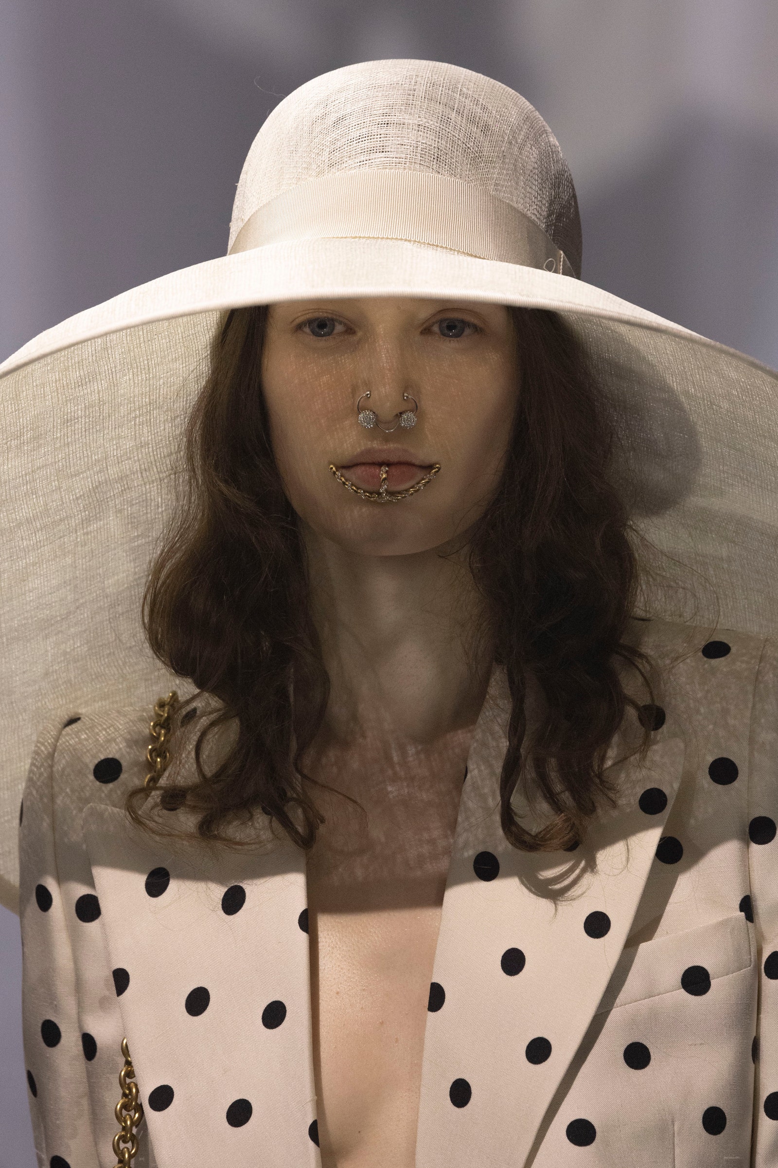 Images may contain clothes, hat, sun hat, adult facial photography portrait and coat