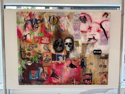 In the collage of labels and logos, two skulls paintings.