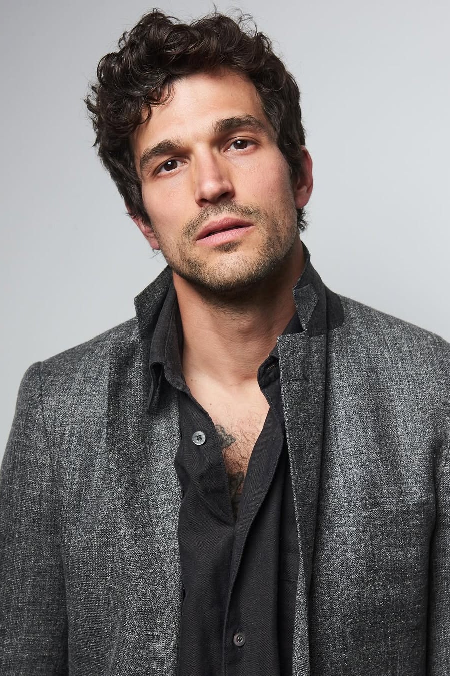 Images may contain face photography portrait of head man body part neck blazer adult blazer and jacket