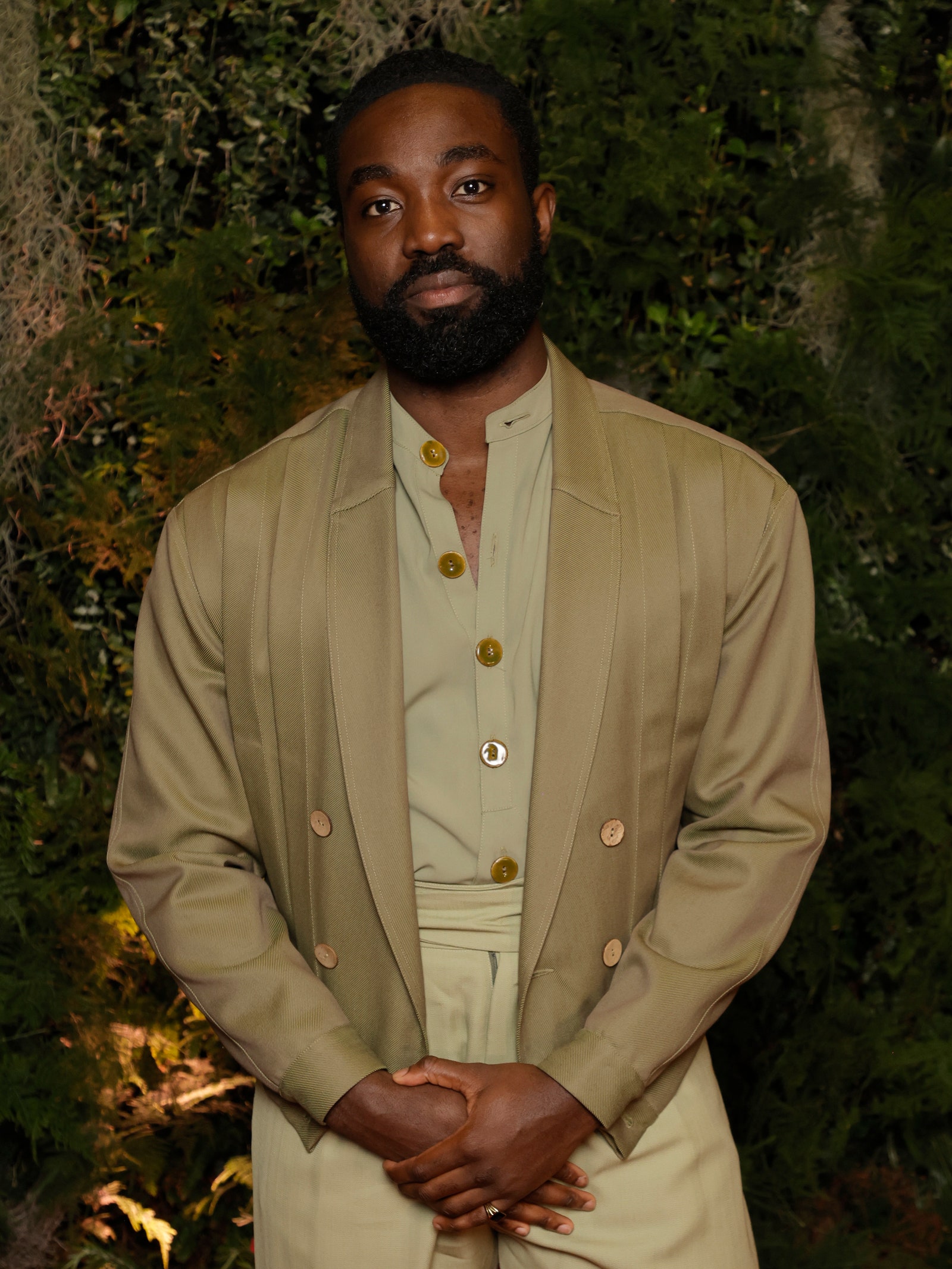 Images may contain Paapa Essiedu blazer clothing blazer standing face photography and portrait