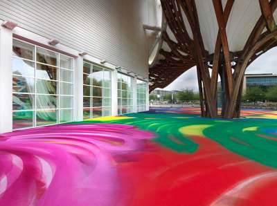 The floor square is covered with spray painted swirls.